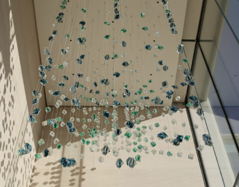 Detail view of the glass suspended sculpture in the morning Detail view of the glass suspended sculpture in the morning