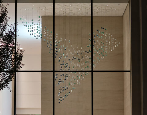 Night time view of the suspended sculpture from across the street Night time view of the suspended sculpture from across the street